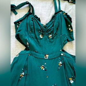 Green floral jumpsuit with side cut outs
